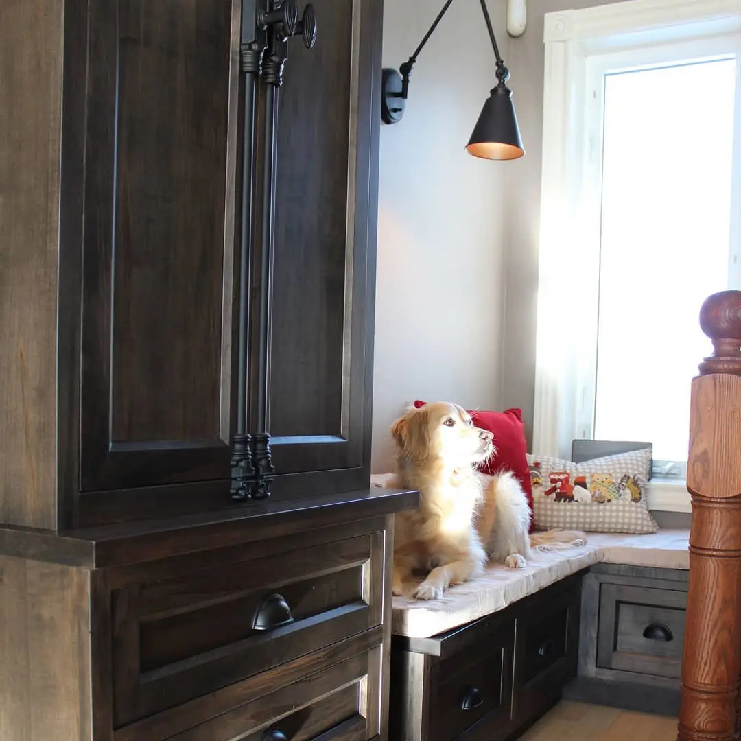 Stained maple built In with hardware and bench cabinetry by Heirlooms Custom Cabinetry