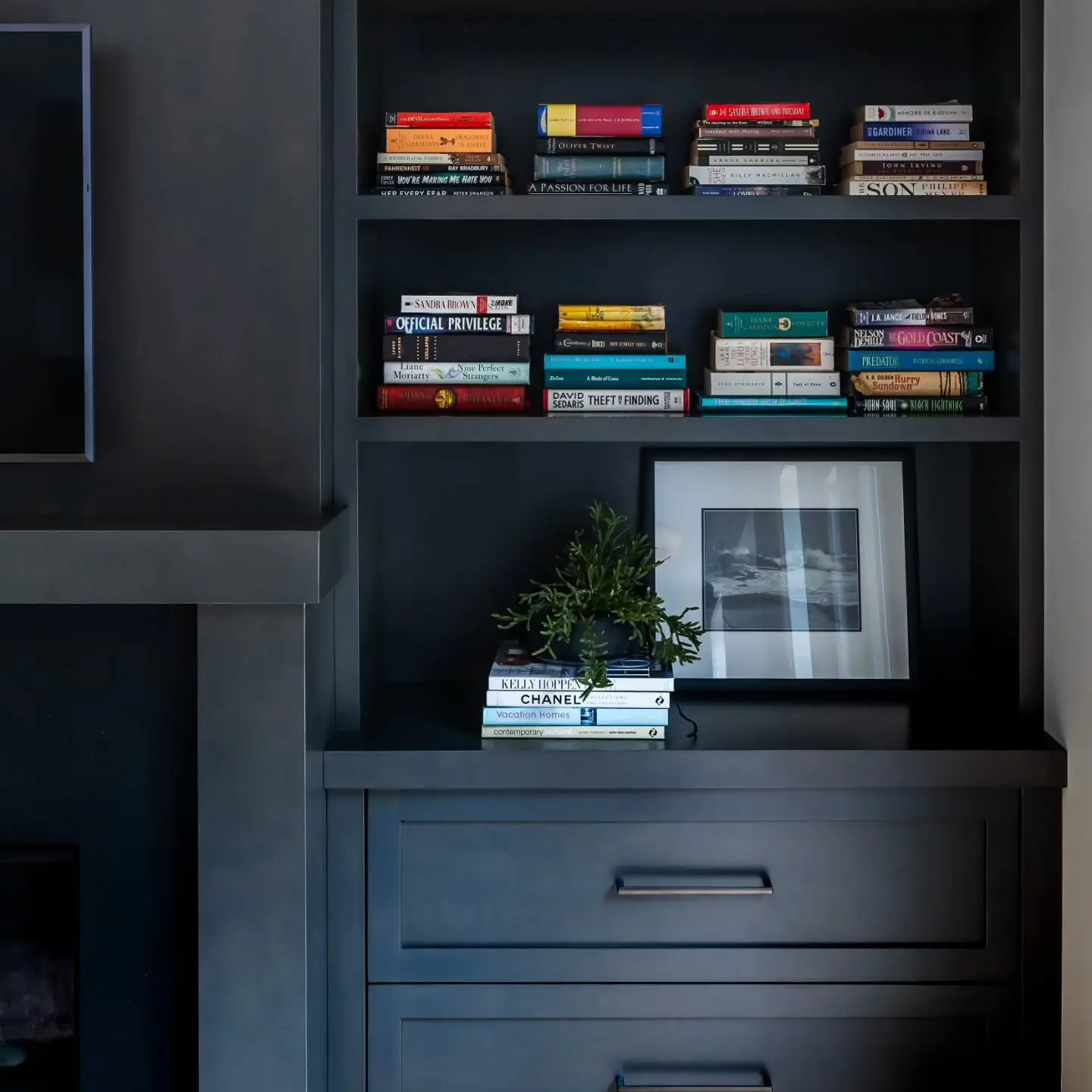 Stained maple fireplace cabinetry by Heirlooms Custom Cabinetry