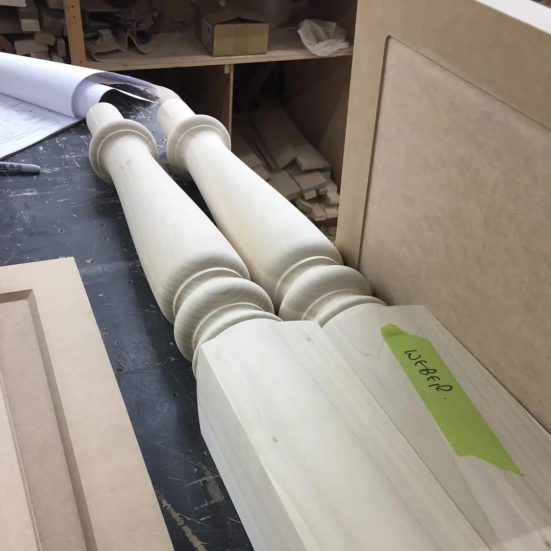 Painted kitchen with island cabinetry by Heirlooms Custom Cabinetry