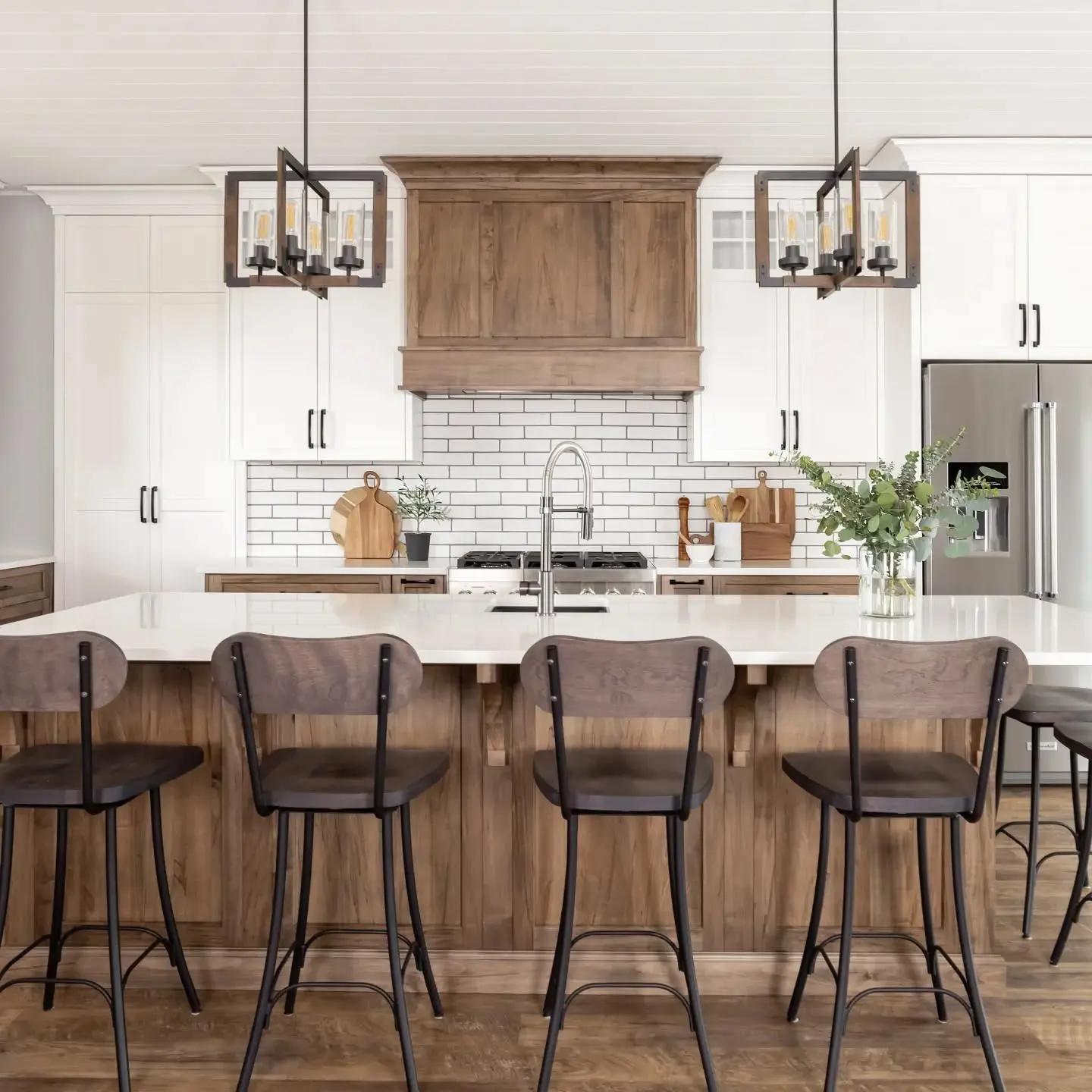 Stained maple kitchen with countertop and hardware cabinetry by Heirlooms Custom Cabinetry