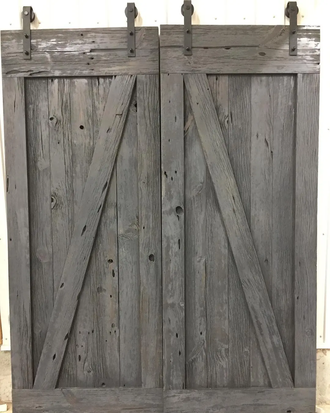Reclaimed wood custom with pantry and barn door cabinetry by Heirlooms Custom Cabinetry