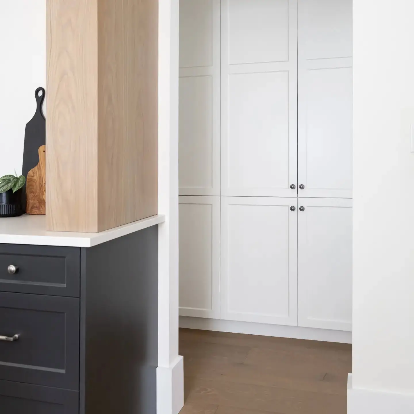 Kitchen with storage and pantry cabinetry by Heirlooms Custom Cabinetry