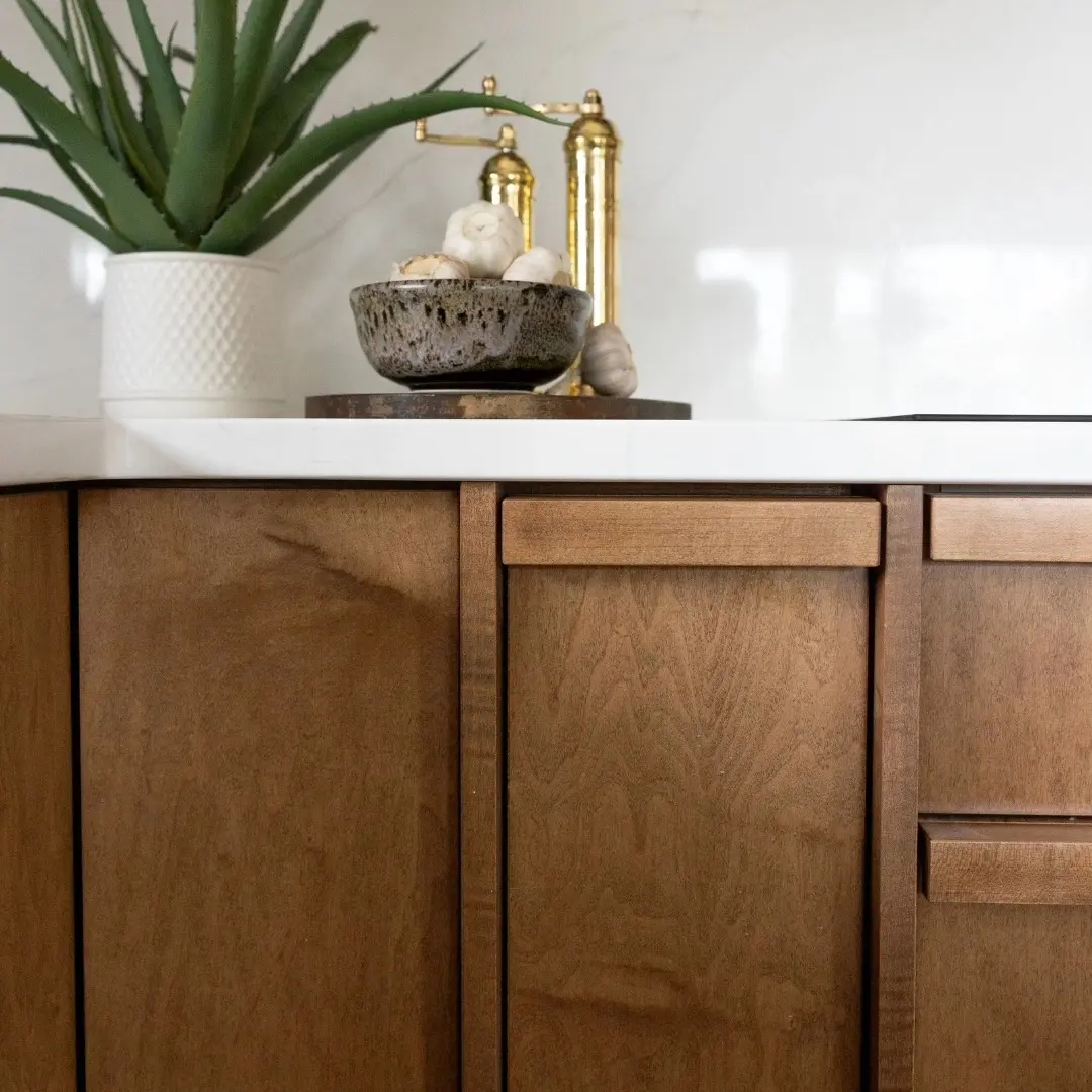 Wood kitchen with hardware and pulls cabinetry by Heirlooms Custom Cabinetry